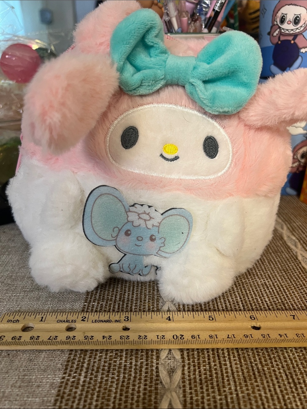 Pink and white character, fuzzy zippered bag